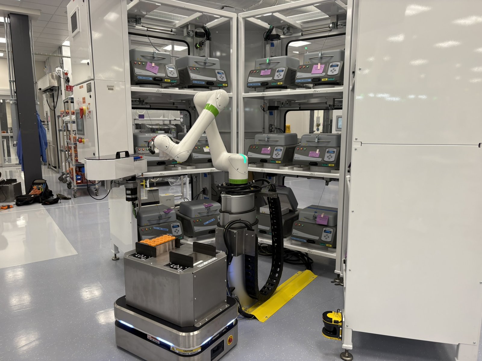 OTTO 100 AMR working alongside a FANUC cobot inside an automated lab pod